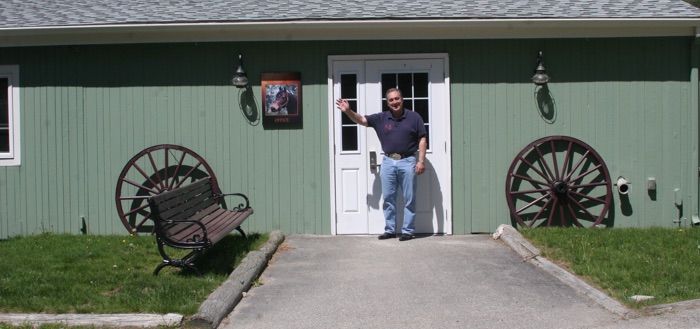 Chrislar barn entry with Larry Cassenti at the door giving a welcoming wave